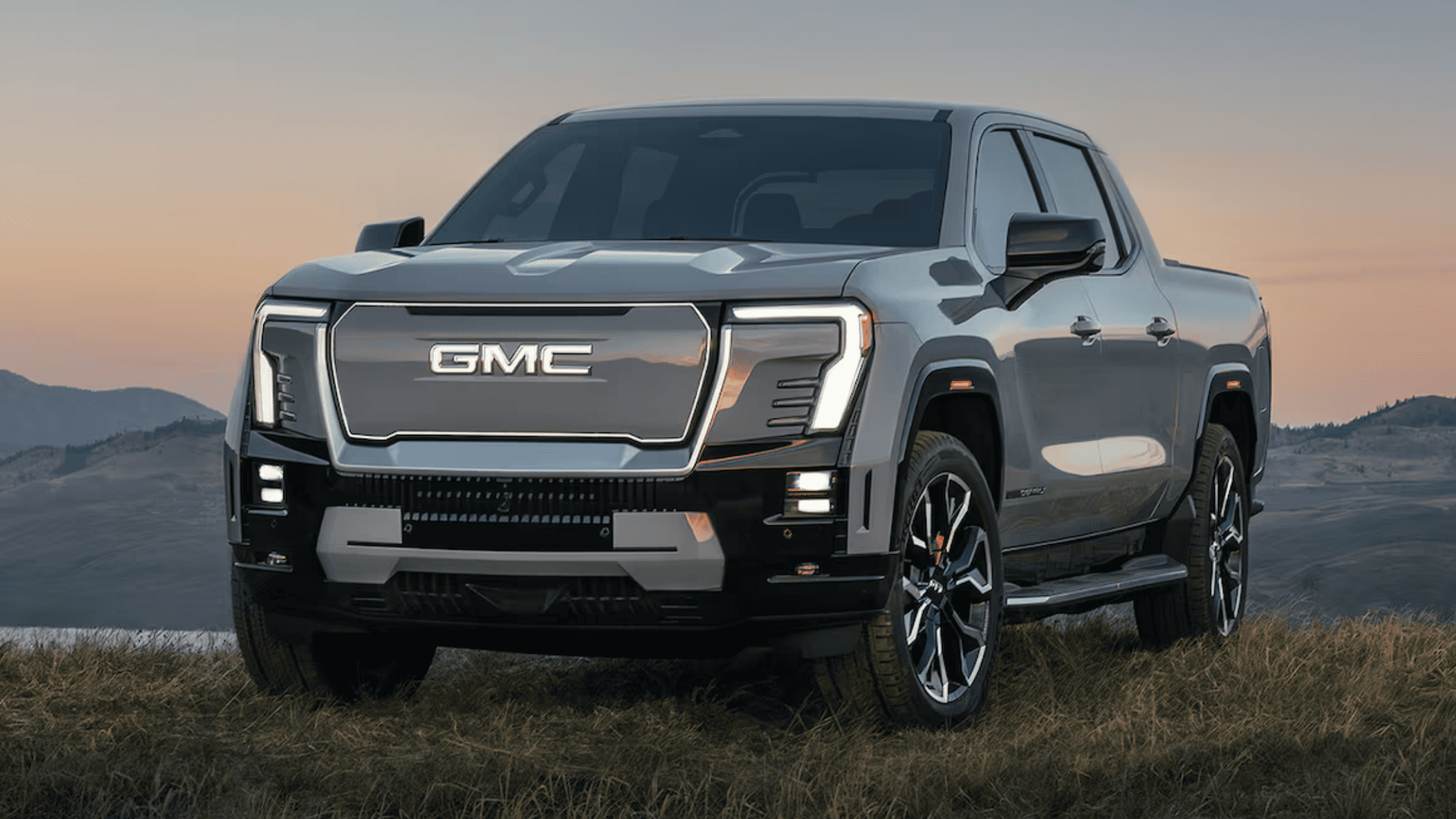 Front view of the 2025 GMC Sierra EV Denali Edition 1 showcasing CrabWalk™ in West Jefferson, NC.