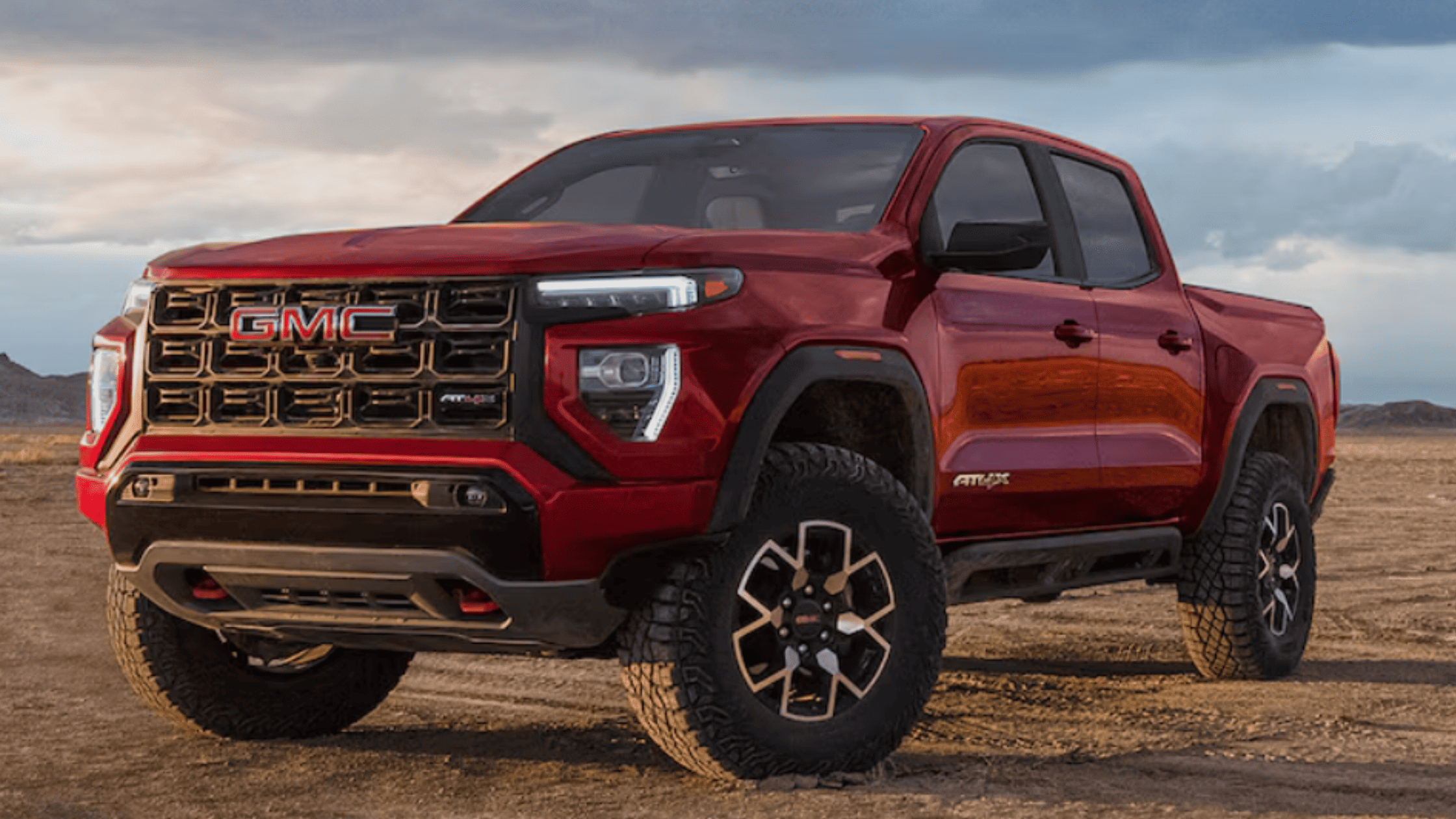 2026 GMC Canyon AT4X truck parked on rugged terrain near Morganton NC highlighting off-road power