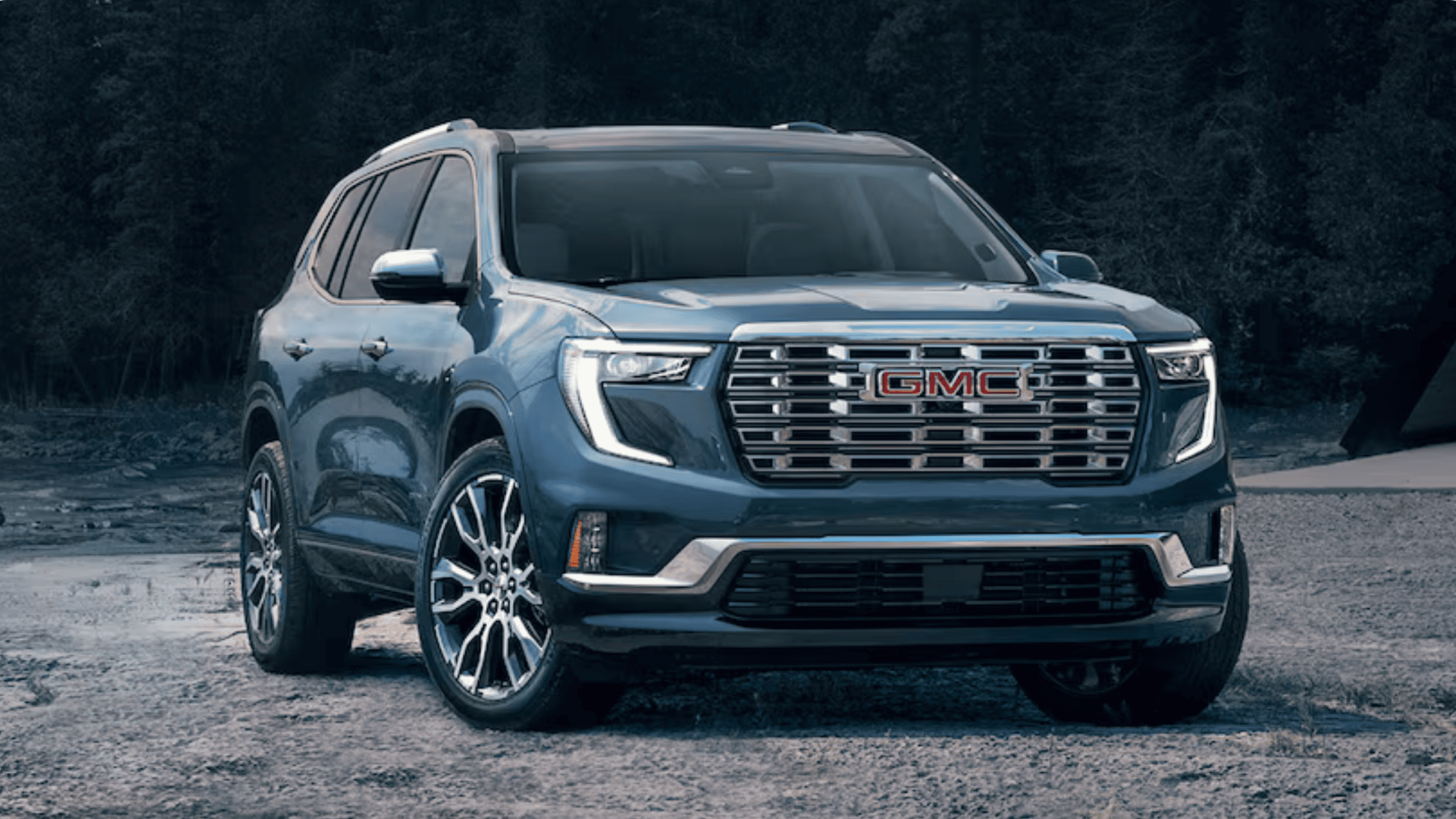 2026 GMC Acadia parked outdoors, showcasing its bold grille and family-friendly SUV design near Morganton NC.