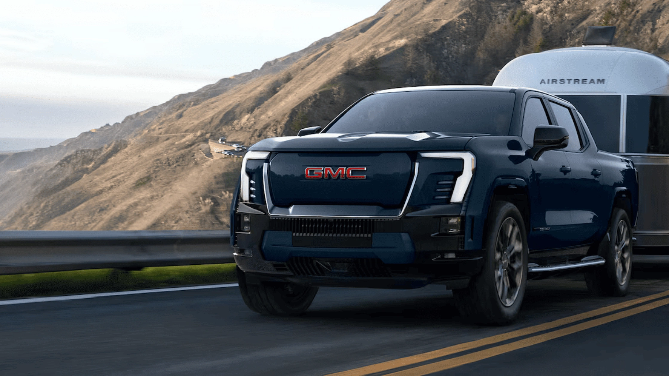 Blue 2026 Chevrolet Colorado pickup truck positioned on desert terrain, built for winter mountain roads near Morganton, NC.