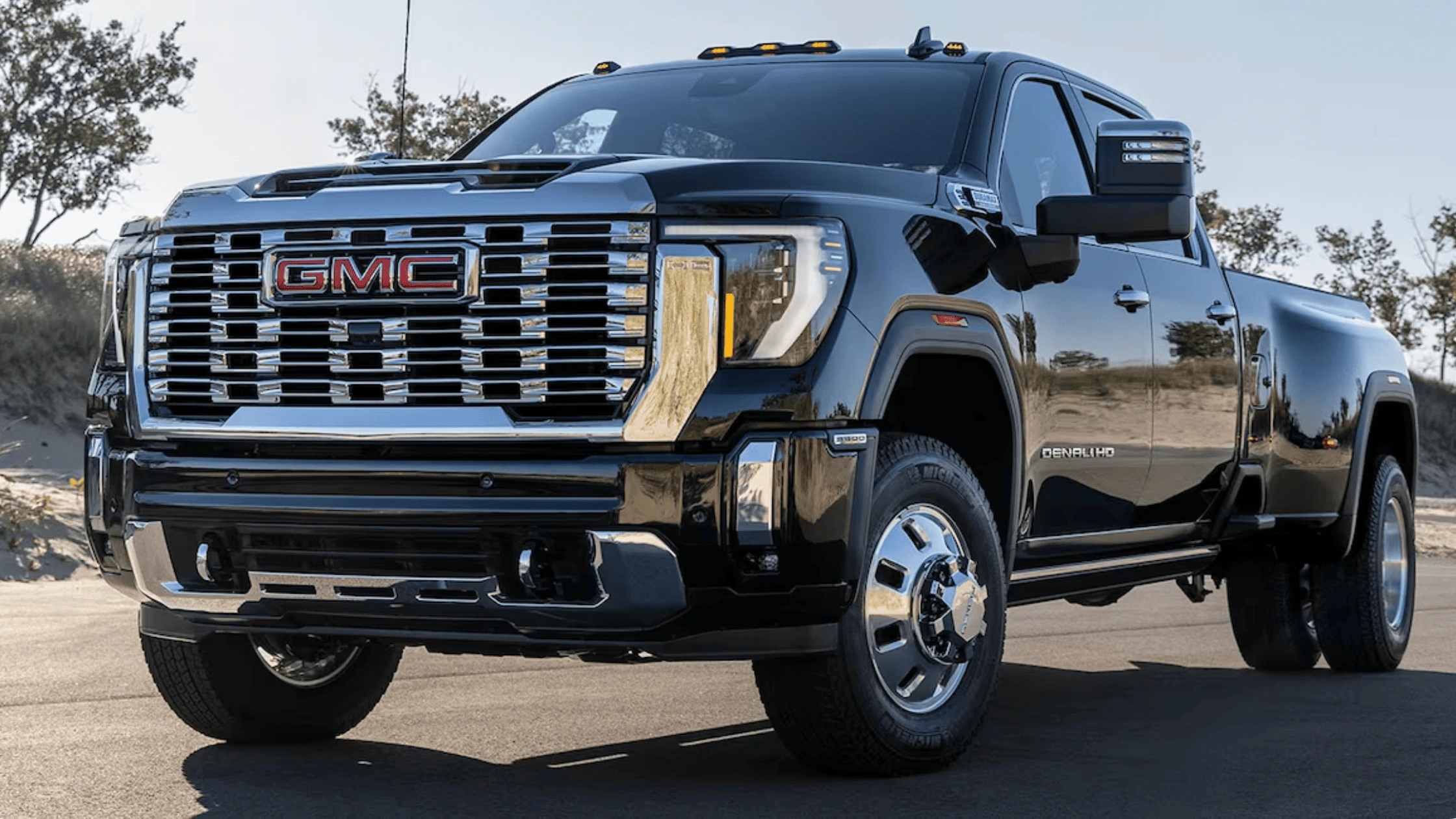 Blue 2027 Chevrolet Bolt electric hatchback driving in an urban setting, highlighting compact EV design for first-time buyers in Morganton, NC.
