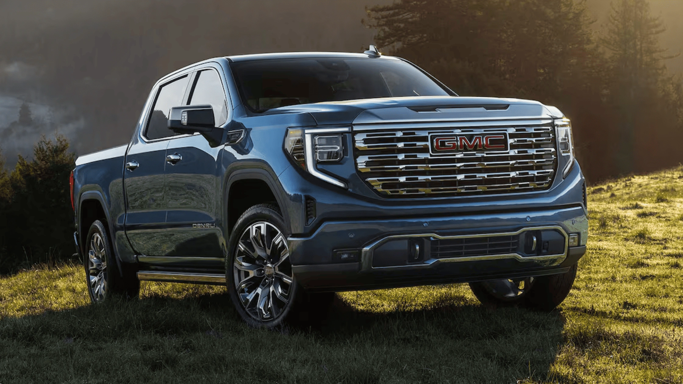 Black 2026 GMC Sierra Heavy Duty Denali with chrome grille parked outdoors, showcasing powerful towing capability for Morganton, NC work crews.