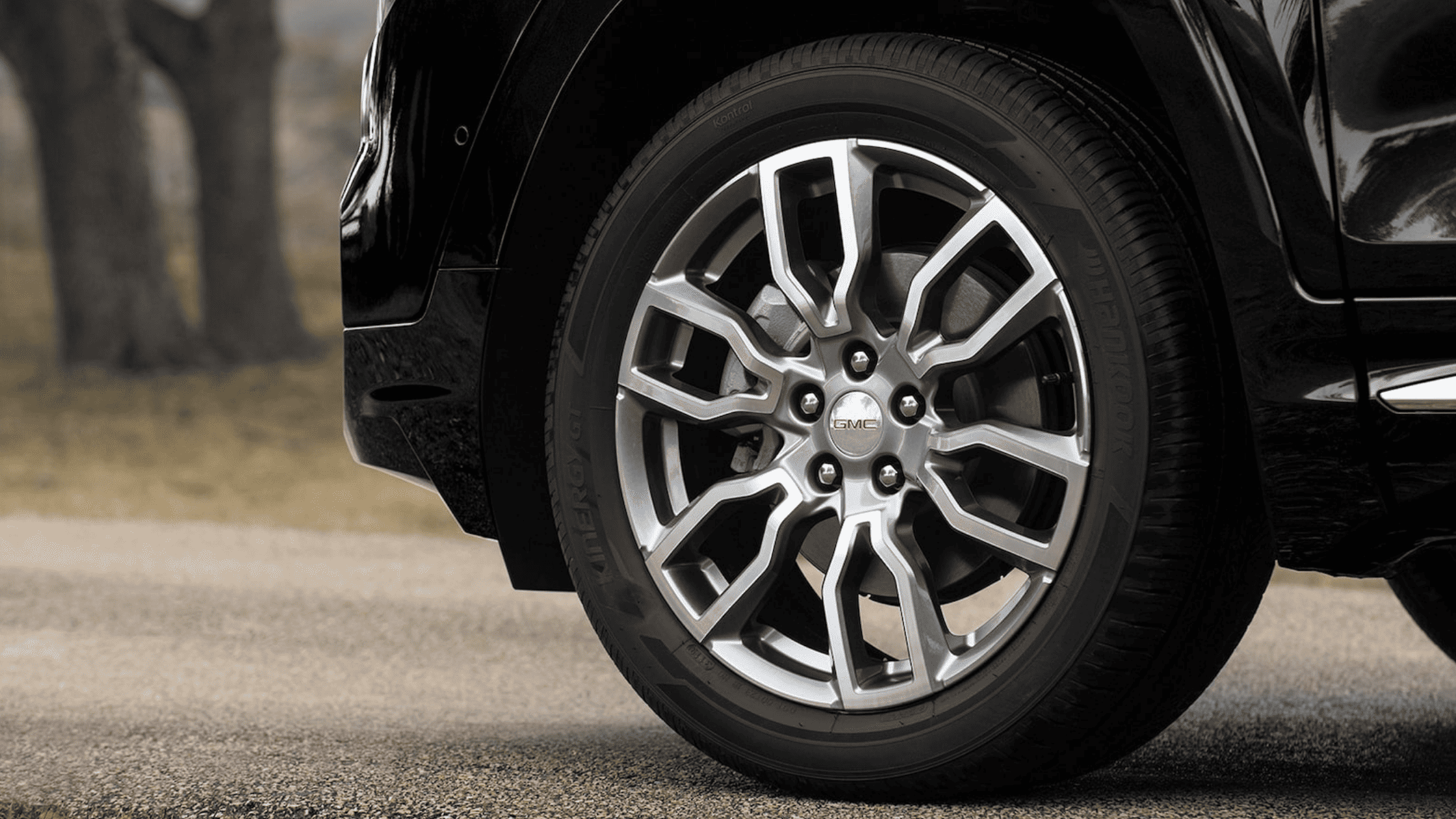 Close-up of GMC Terrain multi-spoke alloy wheel with Hankook tire on pavement.