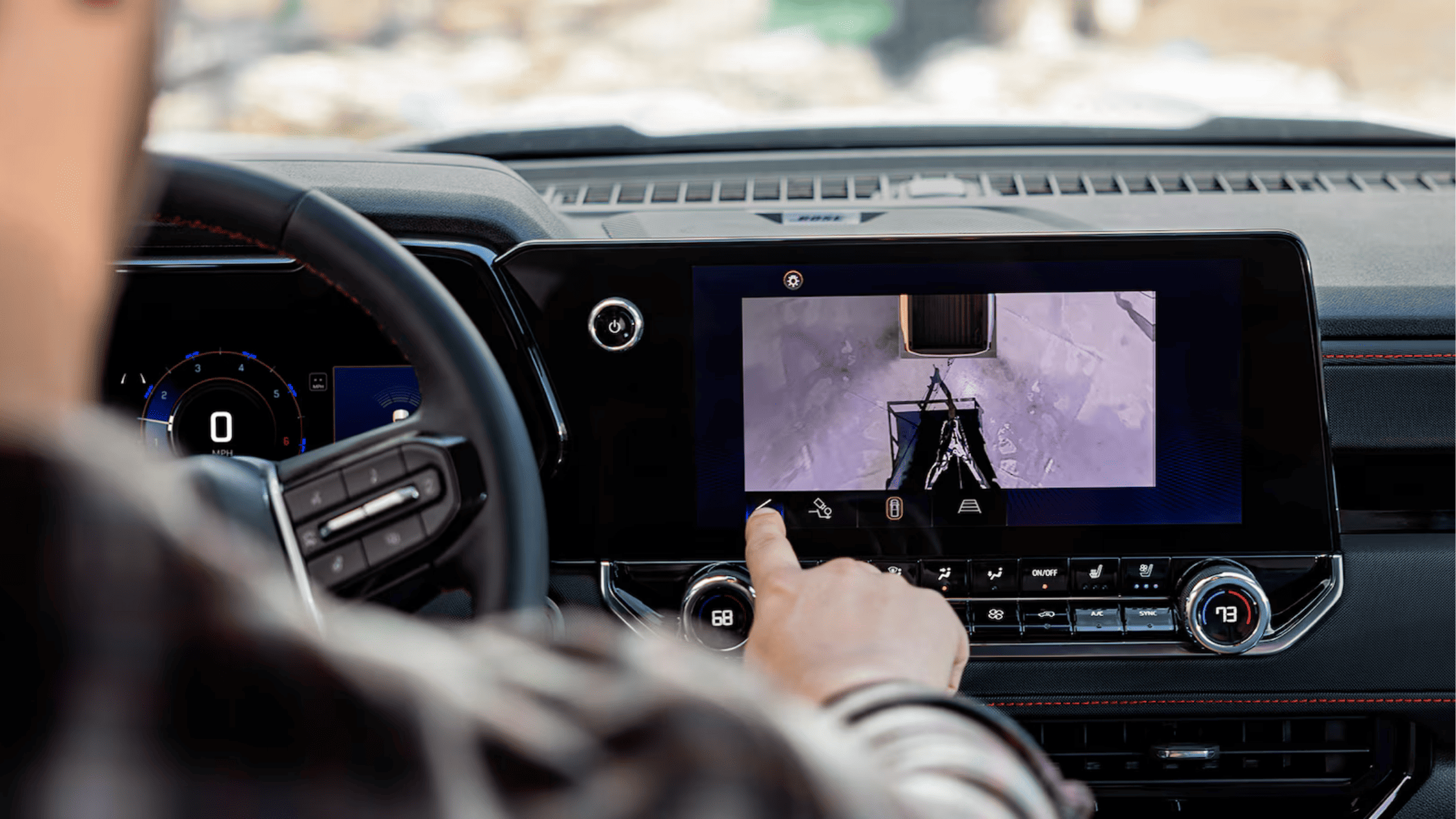 Driver using trailer camera view on Chevrolet Colorado touchscreen display.
