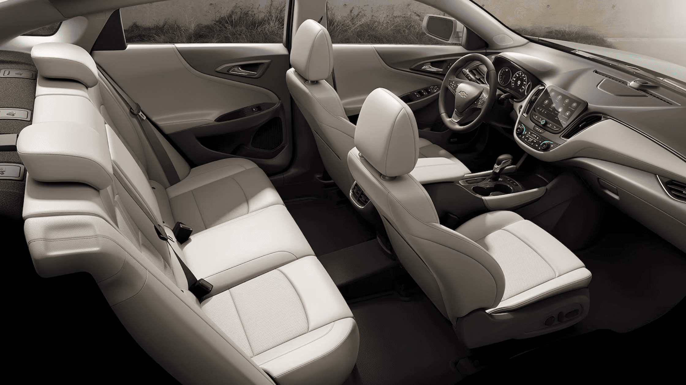 Interior view of the 2025 Chevrolet Malibu with light leather seating and modern dashboard