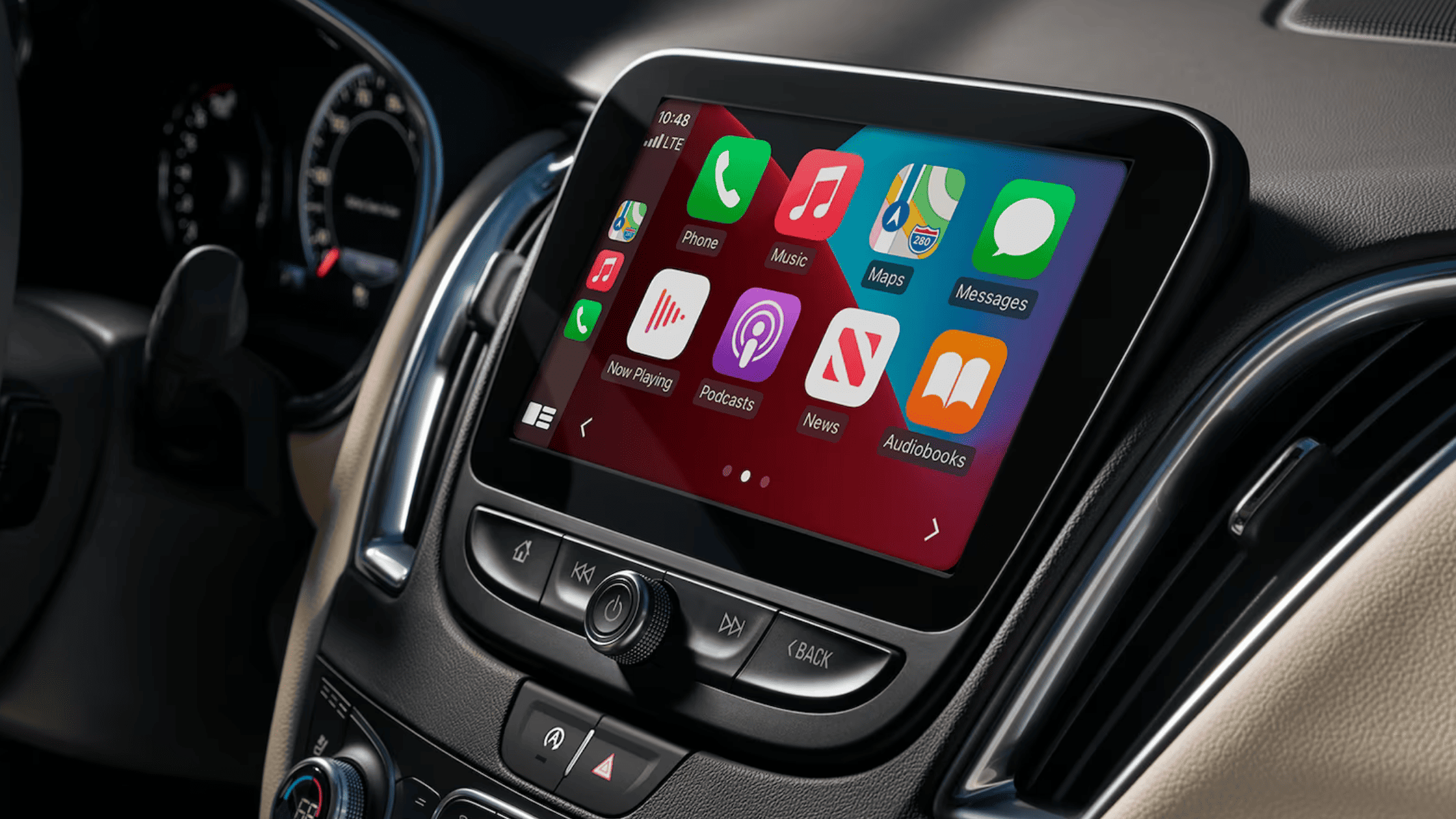 Close-up of the 2025 Malibu infotainment screen with Apple CarPlay interface displayed