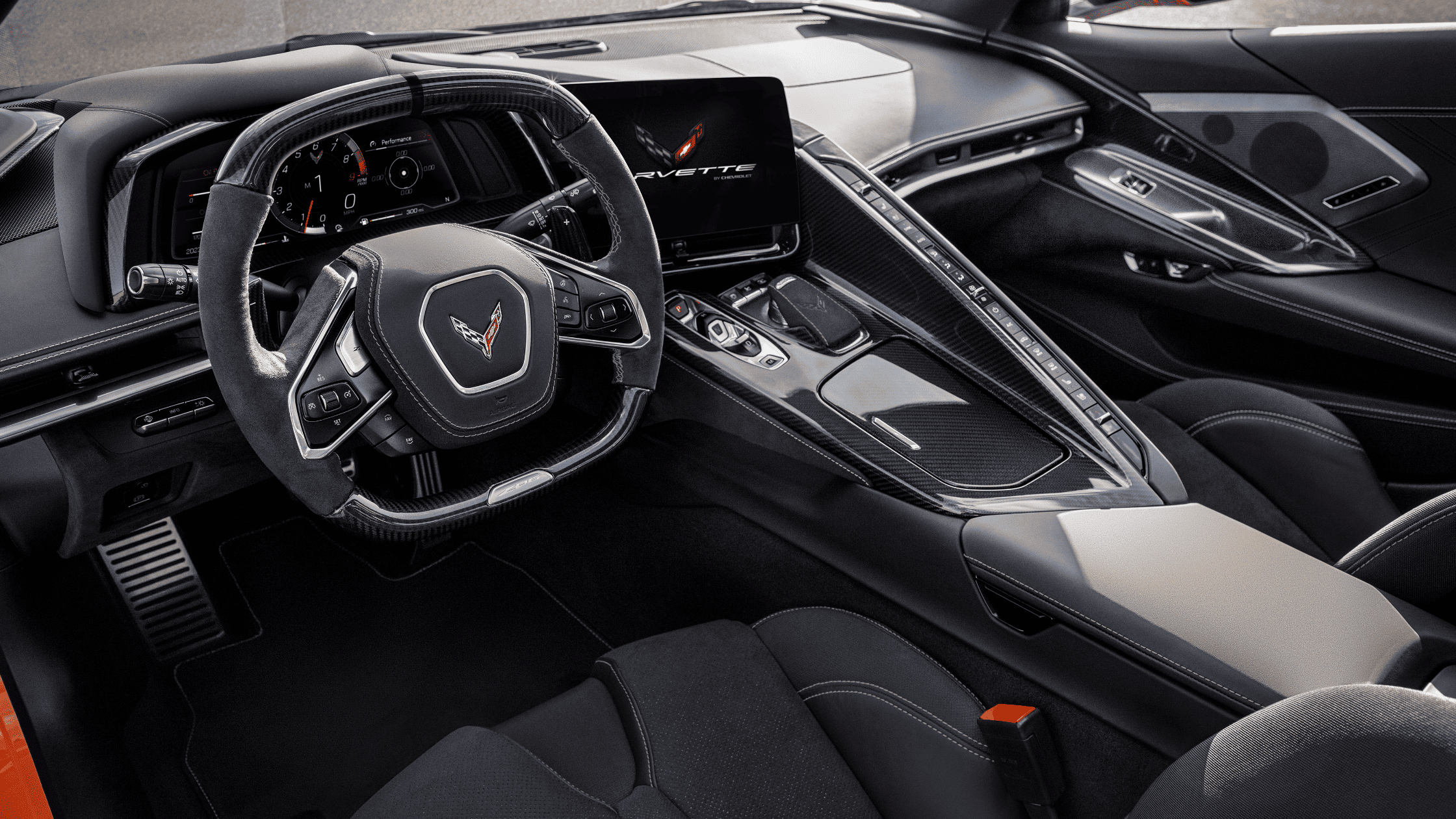 Driver-focused 2024 Corvette Stingray cockpit with performance controls and screen.