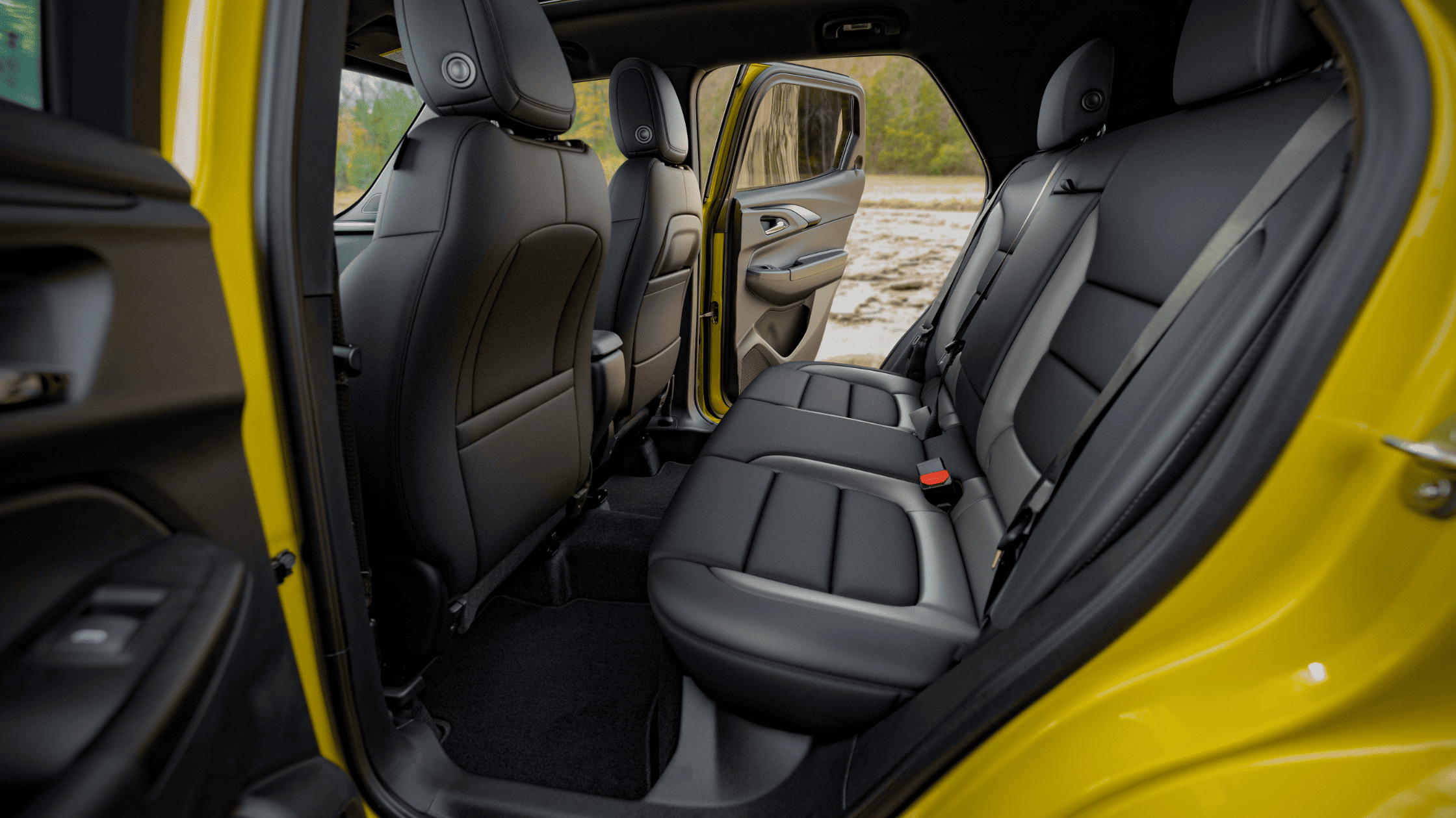 Rear seat interior of 2025 Chevrolet Trailblazer shown with doors open