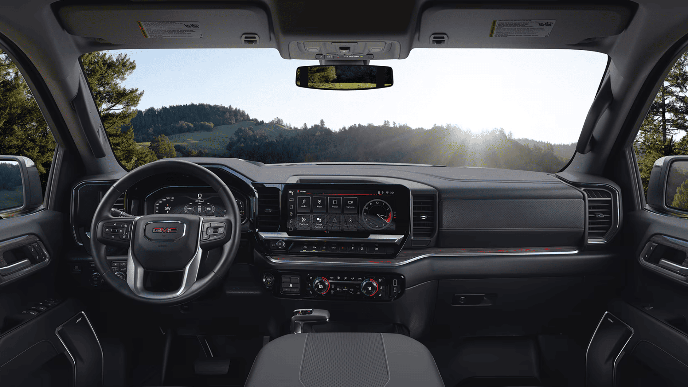 Interior dashboard of 2025 GMC Sierra 1500 with digital gauges and infotainment screen