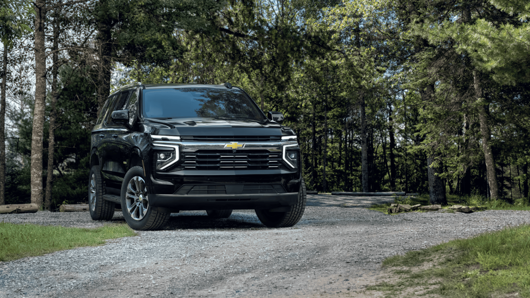 Side view of the 2025 Chevrolet Tahoe parked near Morganton, NC, highlighting its full-size SUV stance and elegant design.