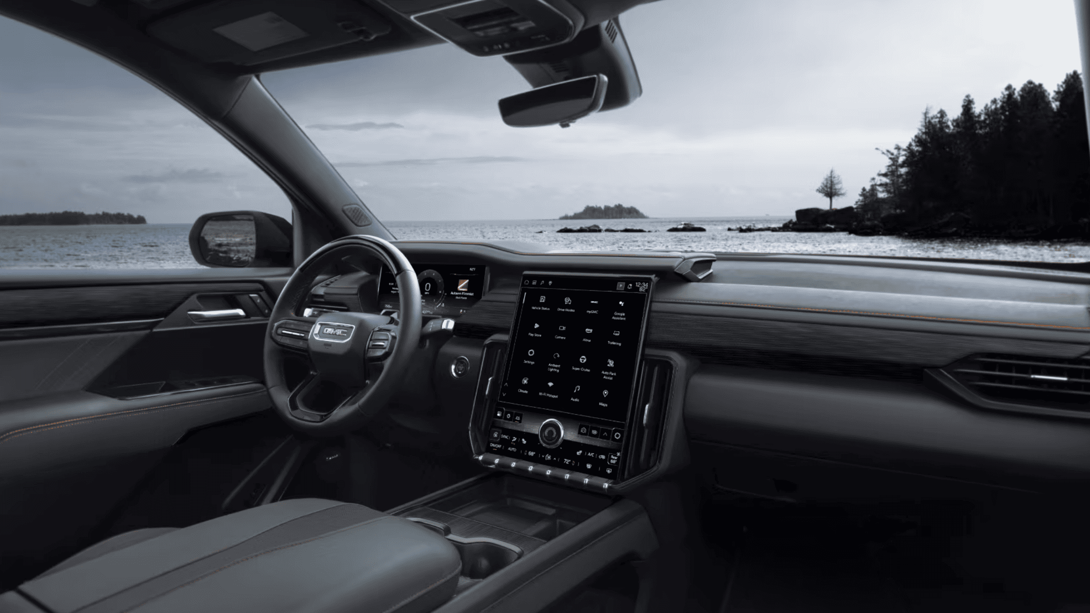 2025 GMC Acadia gear shift selector and control panel with electronic controls for various drive modes and safety features.