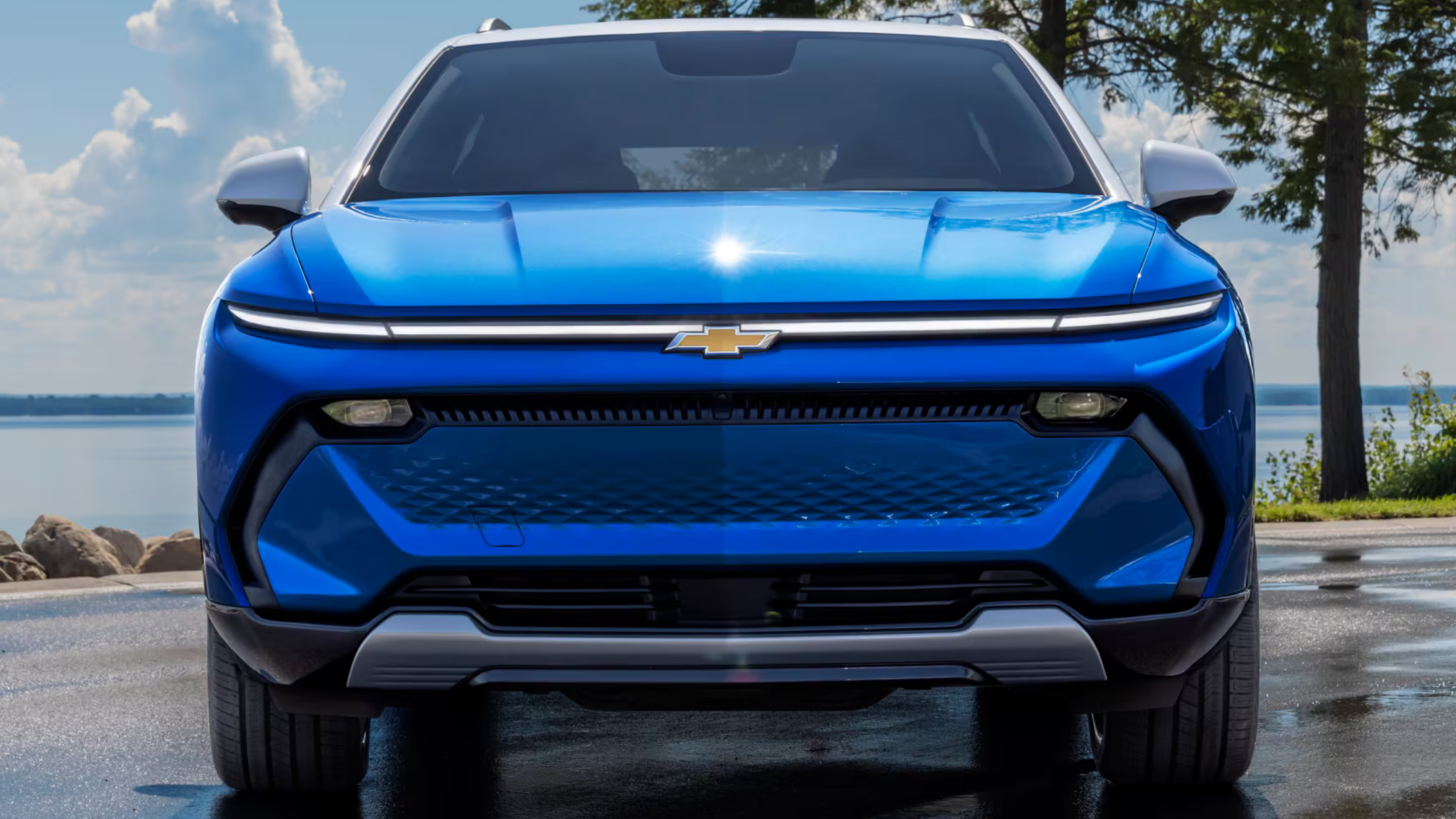 The 2025 Chevrolet Equinox EV parked near West Jefferson, NC, featuring a modern EV grille and sleek profile.