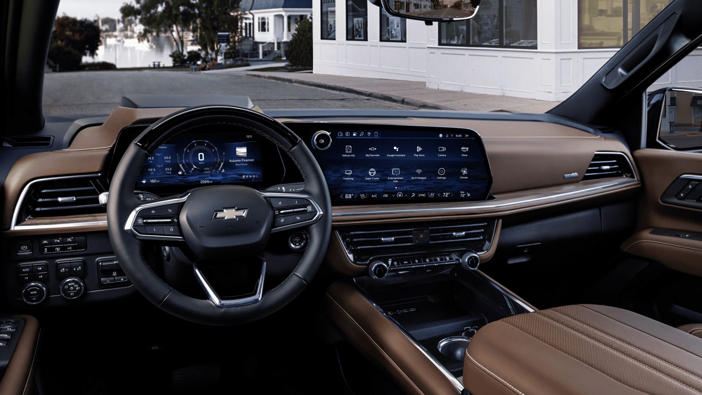 Suburban front cabin with dual digital displays and brown leather