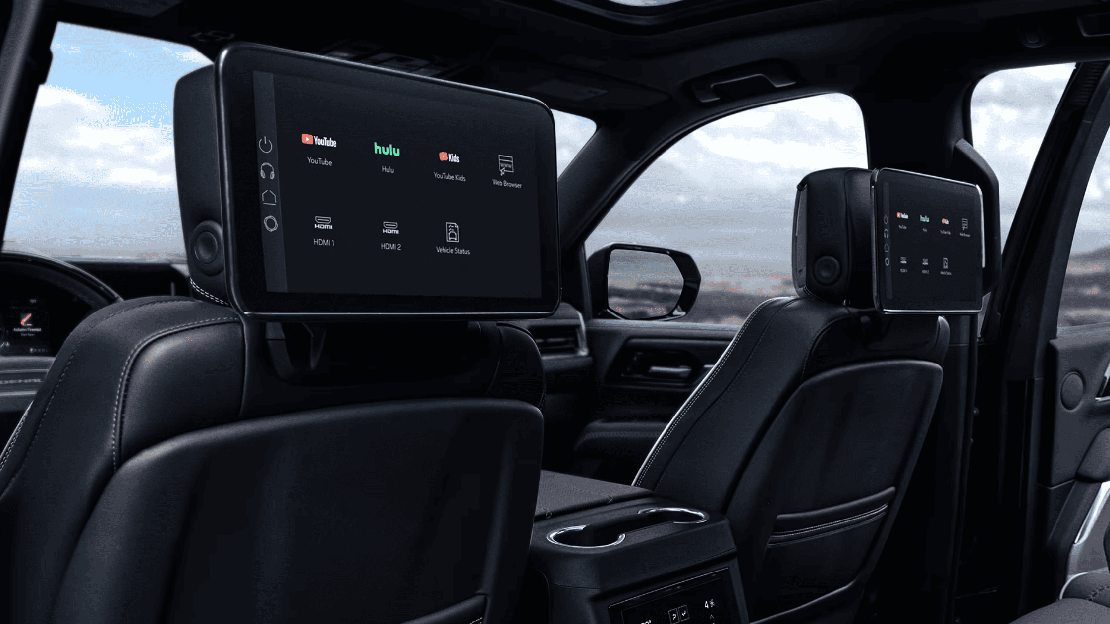 Rear Yukon seats with captain’s chairs and ocean backdrop
