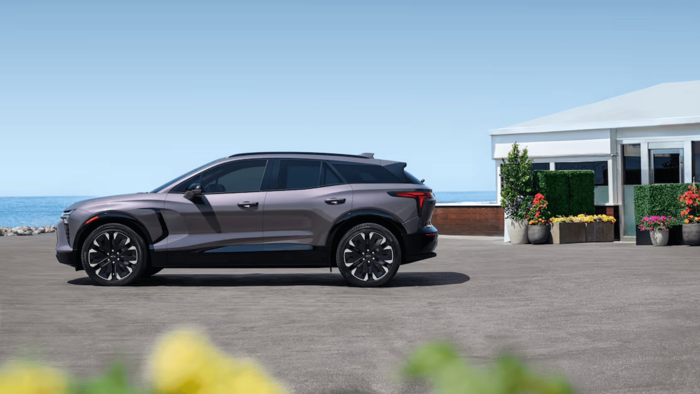 2026 Chevrolet Blazer EV parked near Morganton NC by the coast, highlighting sleek aerodynamic design and electric SUV styling.