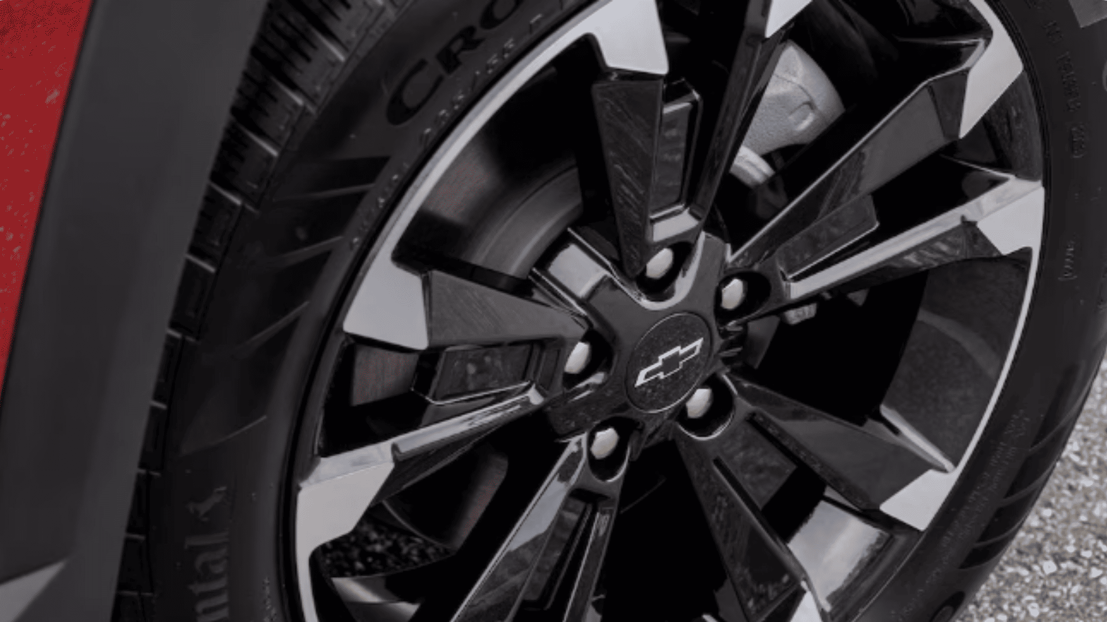 Close-up of the 2026 Chevrolet Equinox alloy wheels with the Chevy bowtie emblem, showcasing detailed rim and tire design.