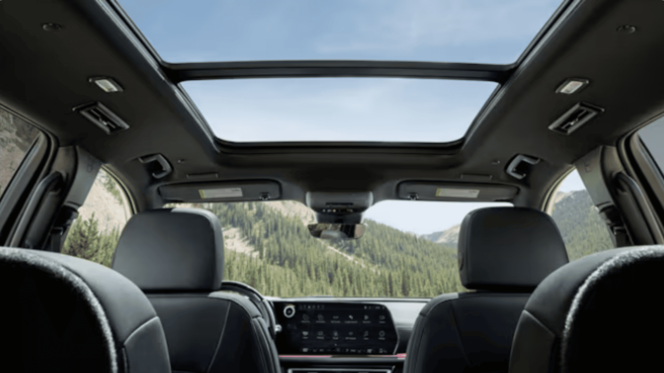 Panoramic interior view of the 2026 Chevrolet Traverse highlighting the spacious cabin layout, seating configuration, and sunroof design.