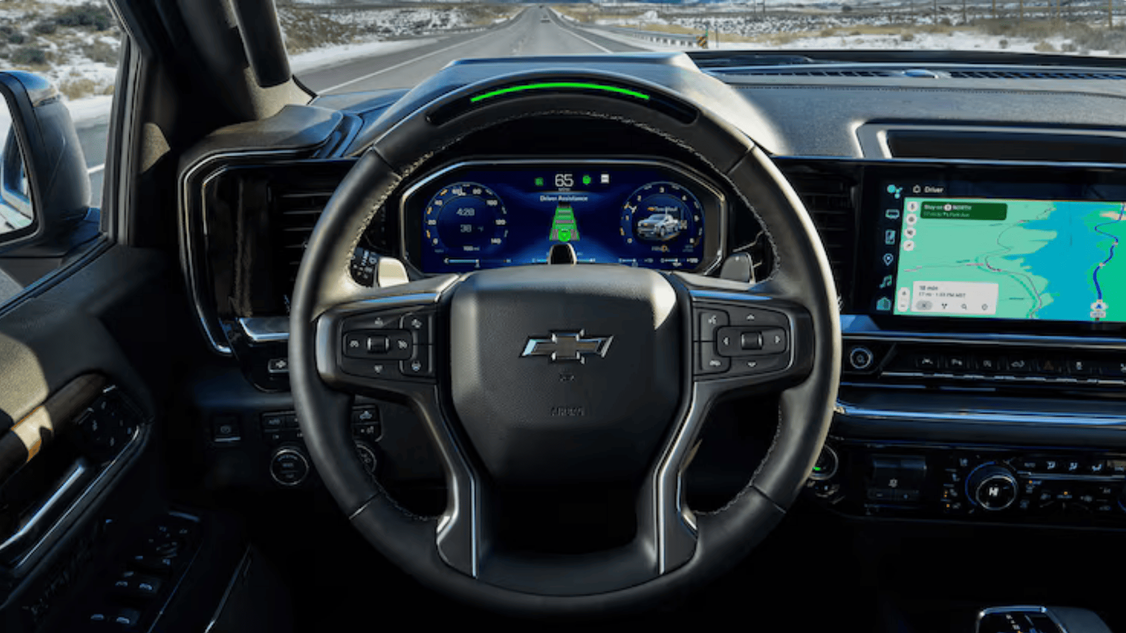 2026 Chevrolet Silverado safety and driver-assistance system view from behind the wheel, highlighting smart cruise control and lane-keeping features.