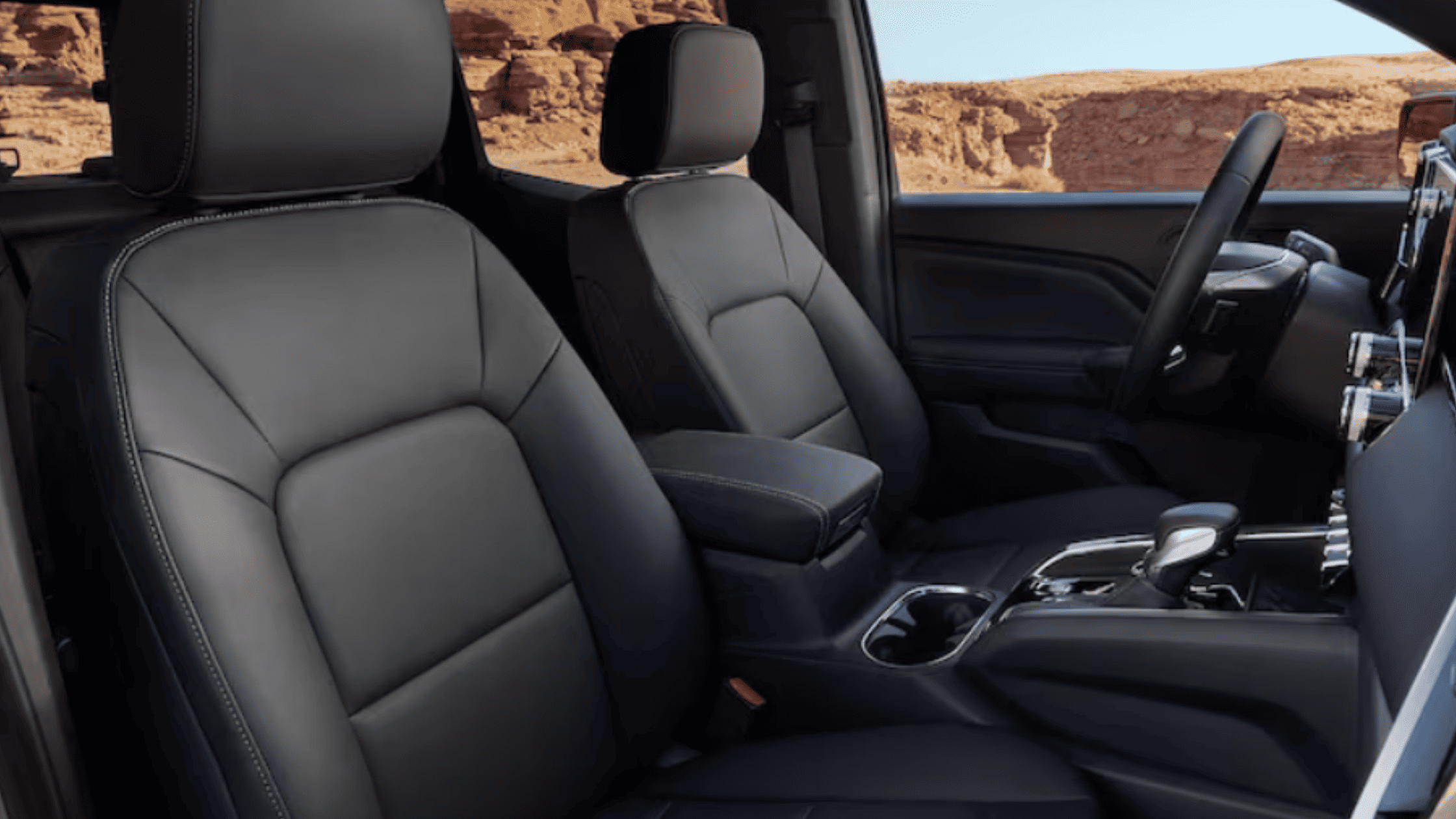 Driver’s digital dashboard in the 2026 GMC Canyon showing the advanced interface with real-time performance and navigation data.