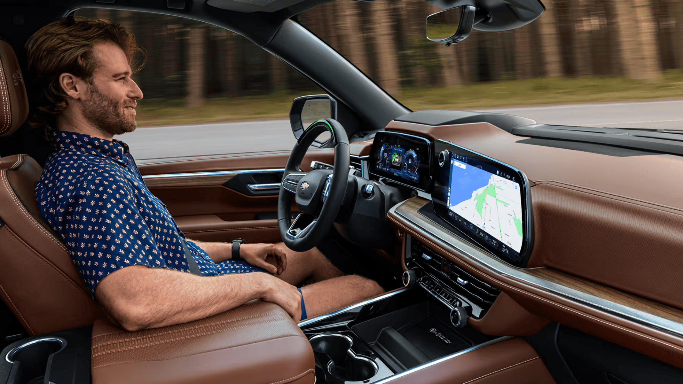 2025 Chevrolet Suburban interior view showing digital cluster and active safety features.