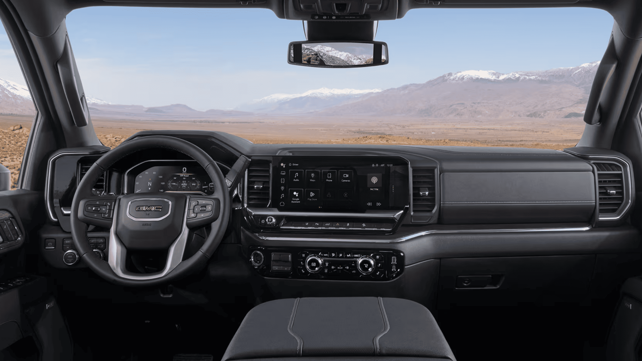 2025 GMC Sierra 2500 interior highlighting modern dashboard with integrated tech features.