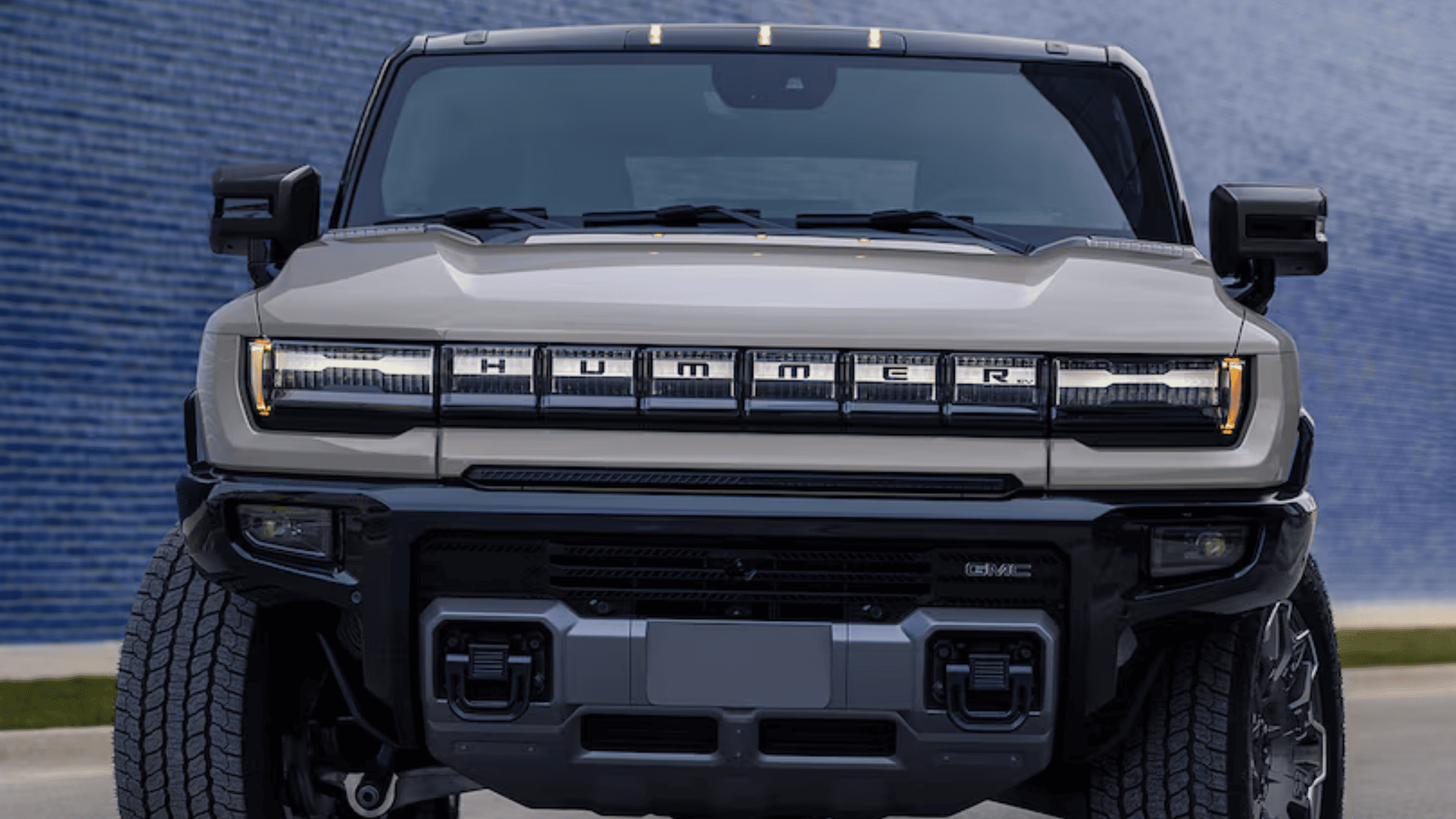 Front exterior view of the 2026 GMC Hummer EV SUV near Morganton, NC, displaying bold grille design, LED lighting, and off-road stance.