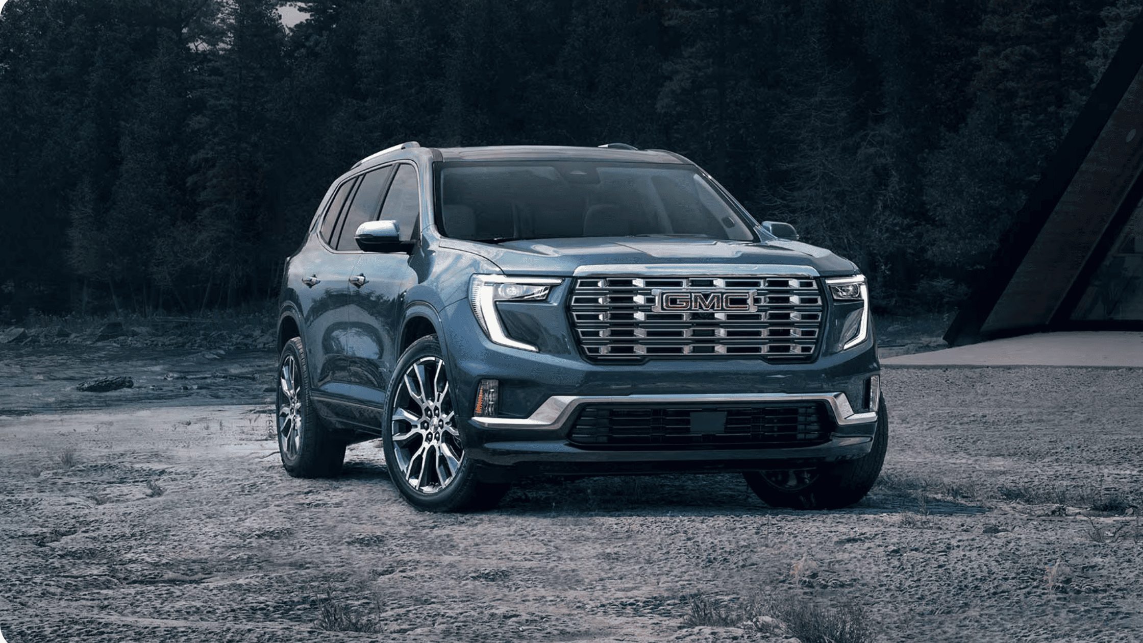 Front view of a 2026 GMC Acadia parked outdoors in Boone, NC, highlighting signature GMC grille and rugged SUV presence.