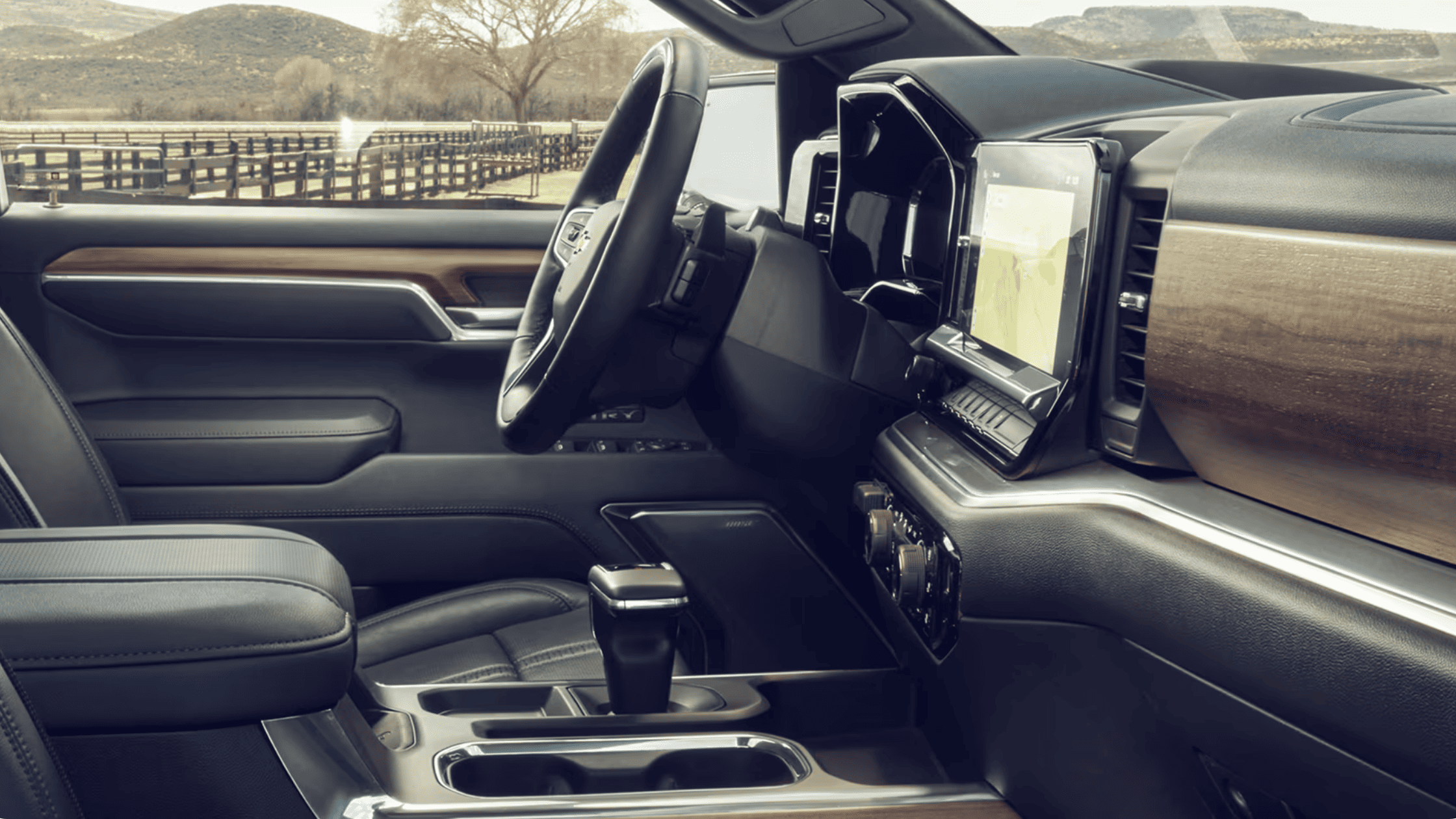 2026 Chevrolet Silverado interior showing center console, touchscreen display and wood trim in Boone, NC