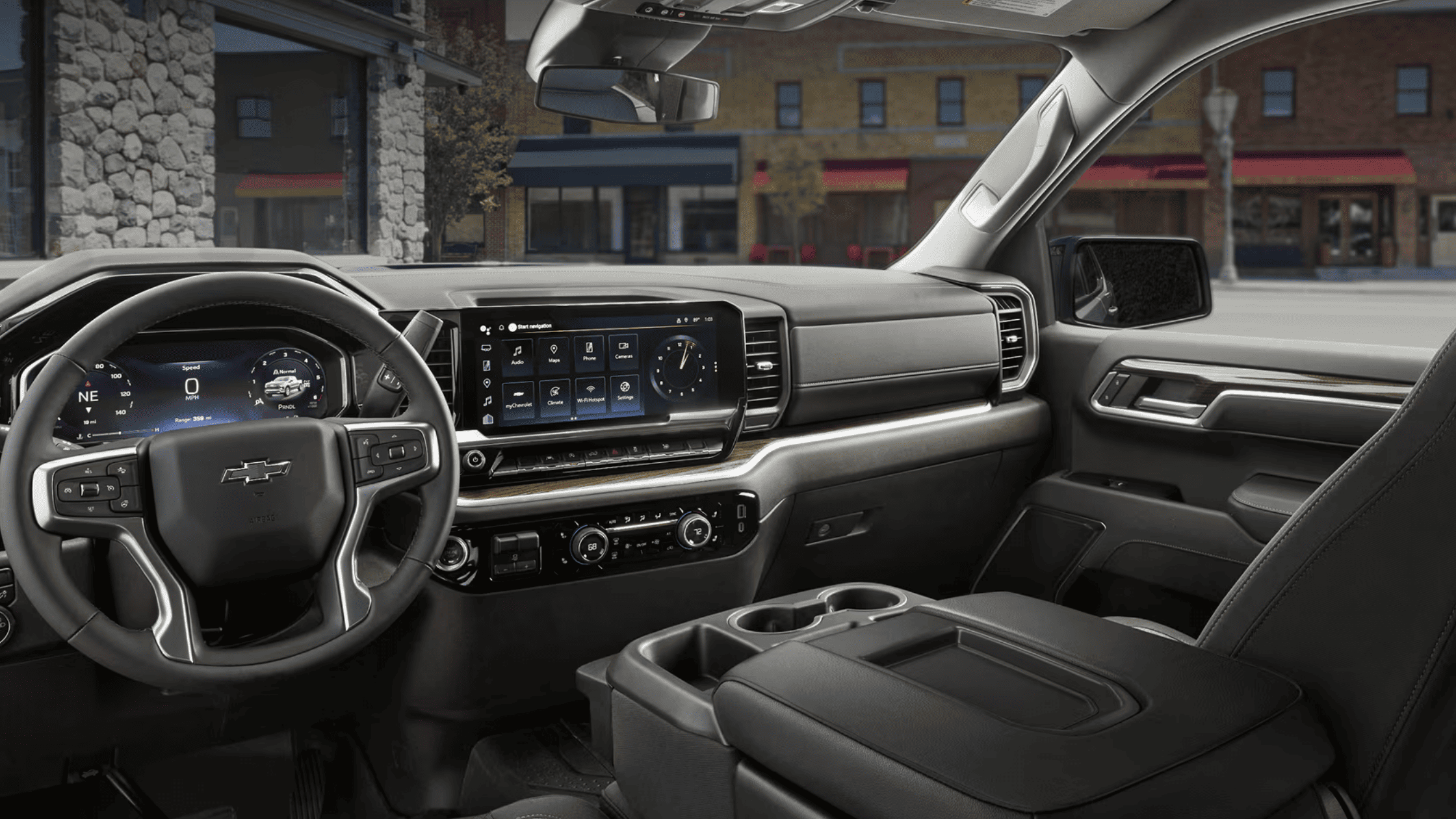2026 Chevrolet Silverado dashboard with wide touchscreen infotainment display and Bowtie steering wheel in Boone, NC.