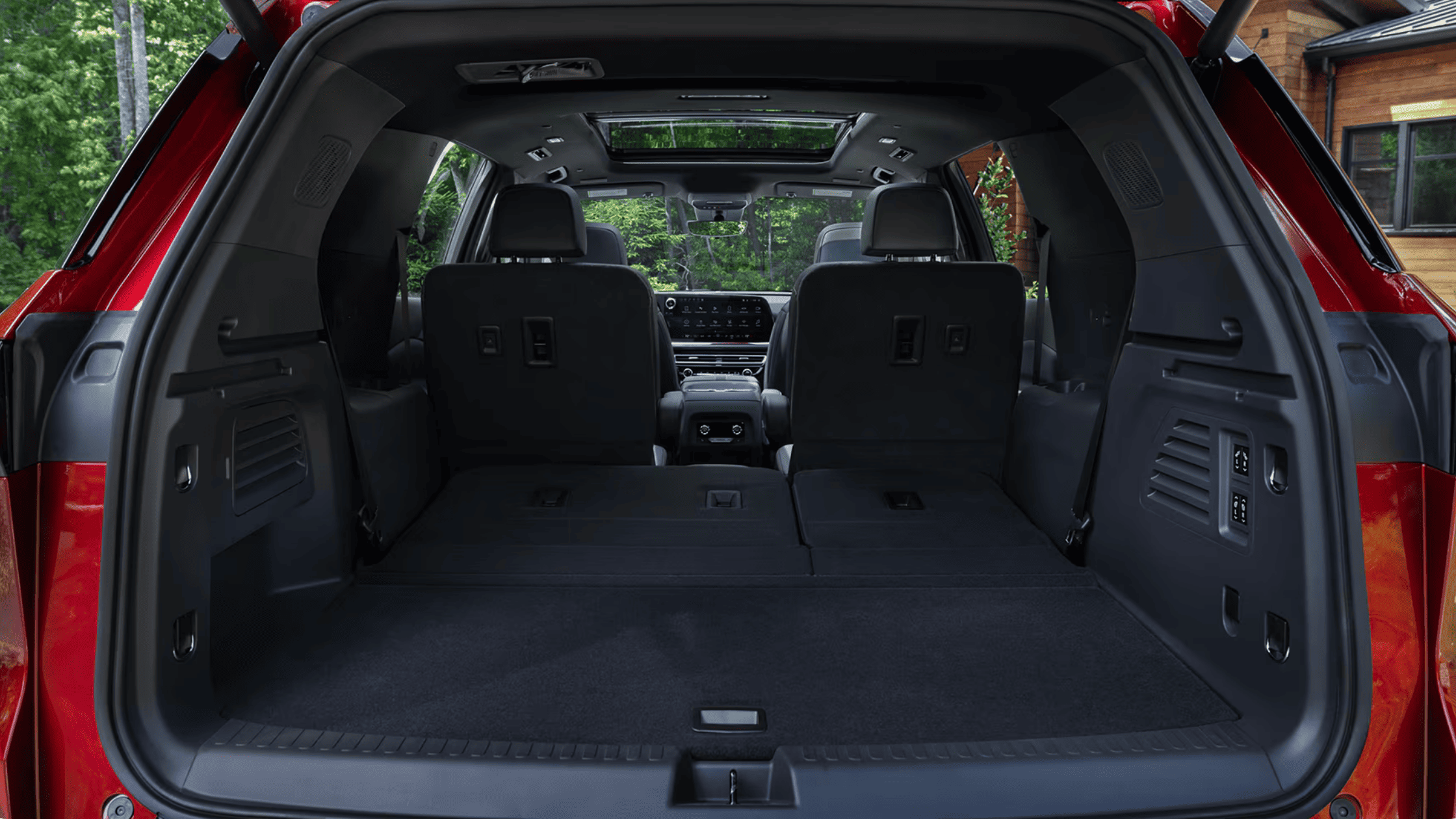 2026 Chevrolet Traverse wide open cargo area with rear seats folded flat in Boone, NC.