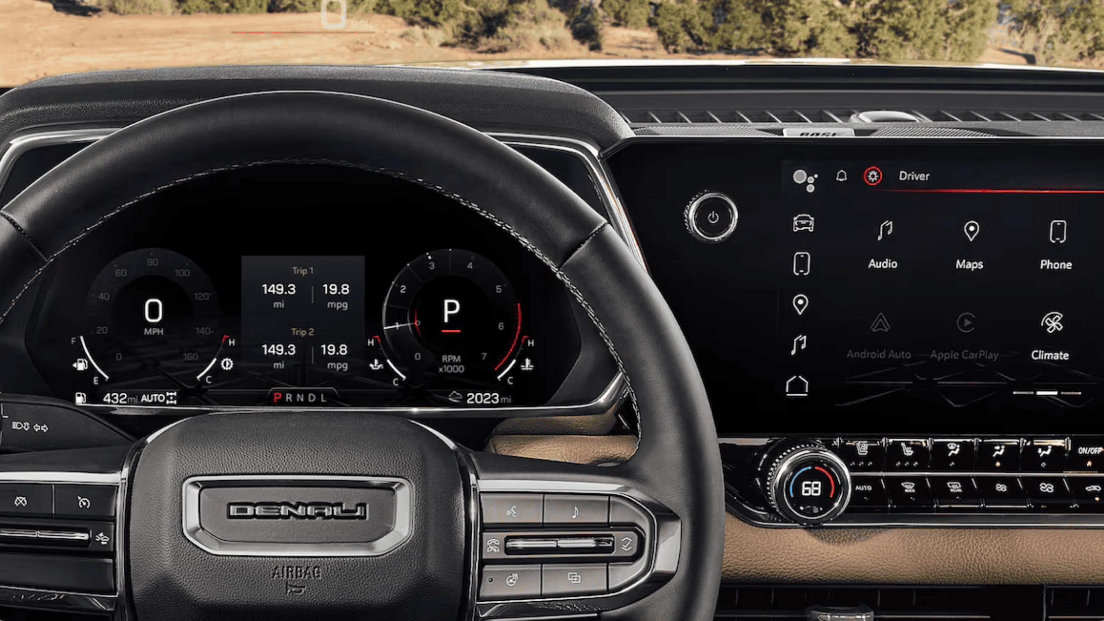 2026 GMC Canyon Denali digital instrument cluster and widescreen infotainment display in Boone, NC.