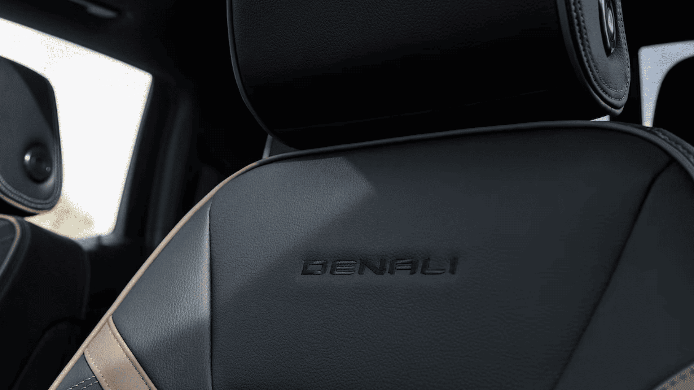 Close-up of 2026 GMC Canyon Denali embossed black leather seat in Boone, NC