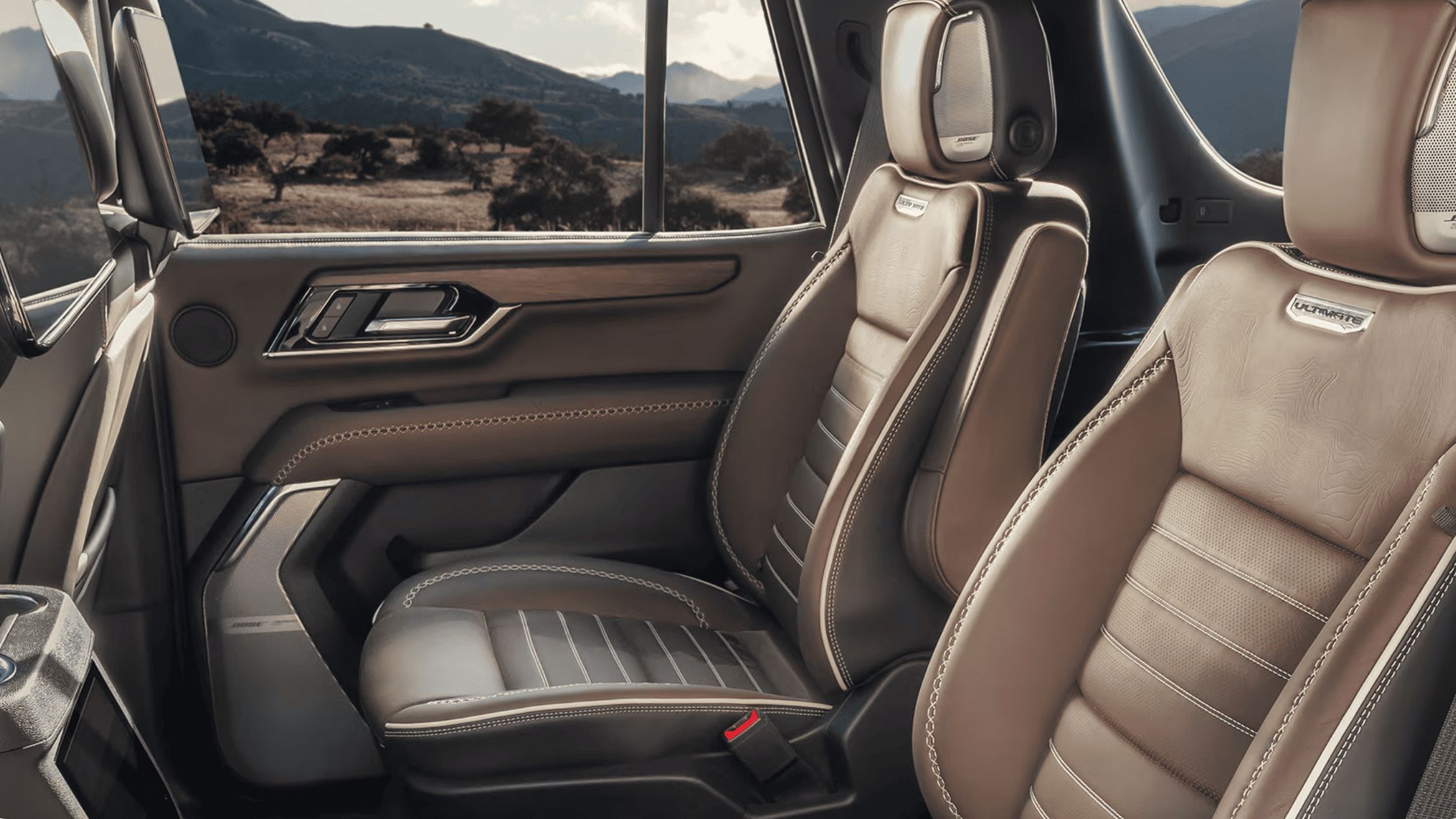 2026 GMC Yukon Denali Ultimate tan leather second-row seating with wood trim in Boone, NC.